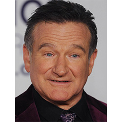 Robin Williams in a wine coloured suede suite and black shirt